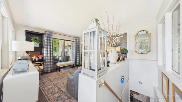 a view of a patio with couches table and chairs and potted plants