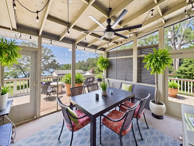 a view of a dining room with furniture a chandelier and wooden floor