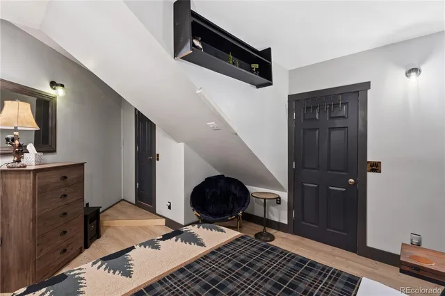 a bedroom with a bed and a couch