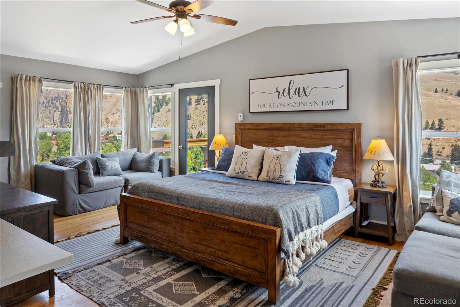 301 West 3rd Street Creede, CO 81130 - Photo 12 of 24 a bedroom with a bed and a couch