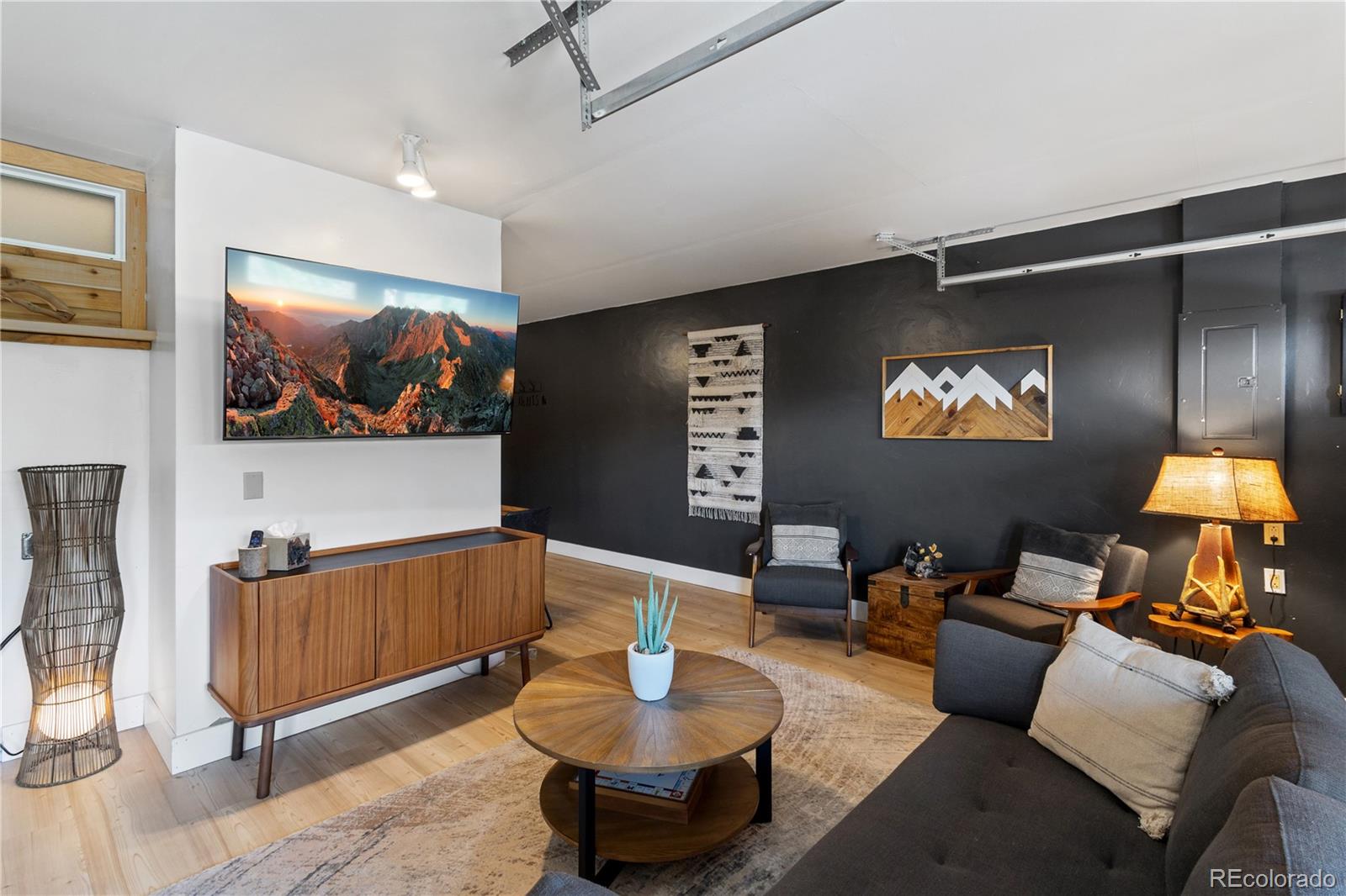301 West 3rd Street Creede, CO 81130 - Photo 4 of 24 a living room with furniture and a flat screen tv