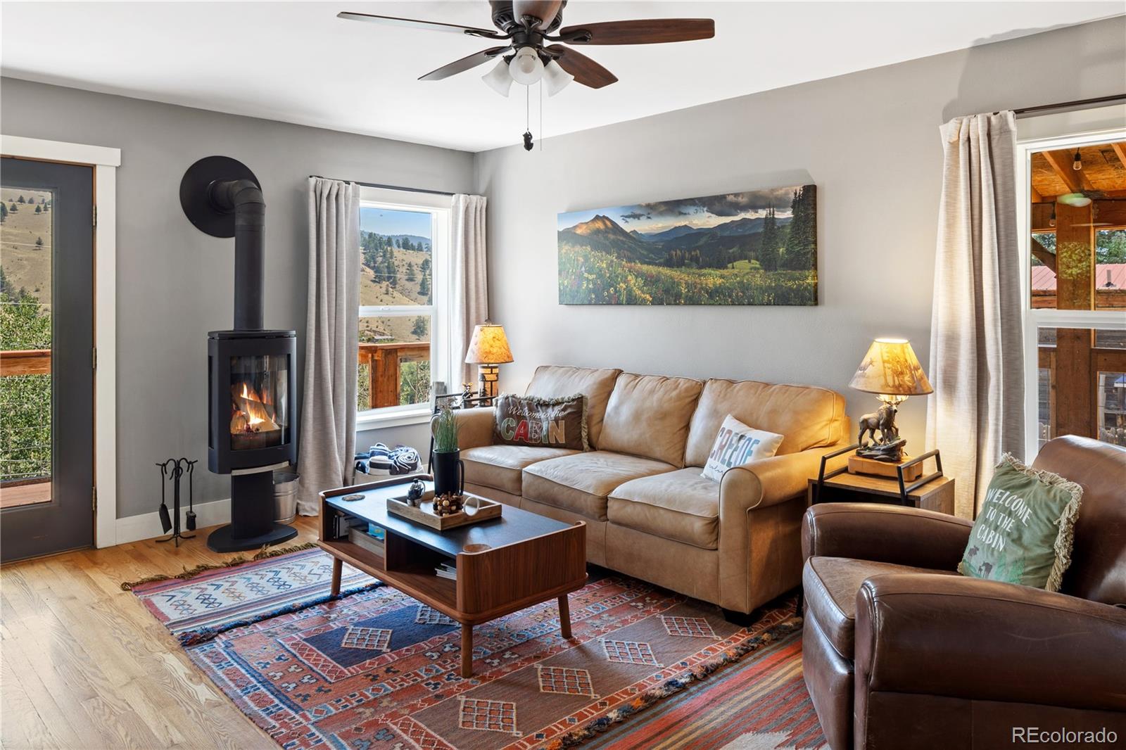 301 West 3rd Street Creede, CO 81130 - Photo 7 of 24 a living room with furniture and a window