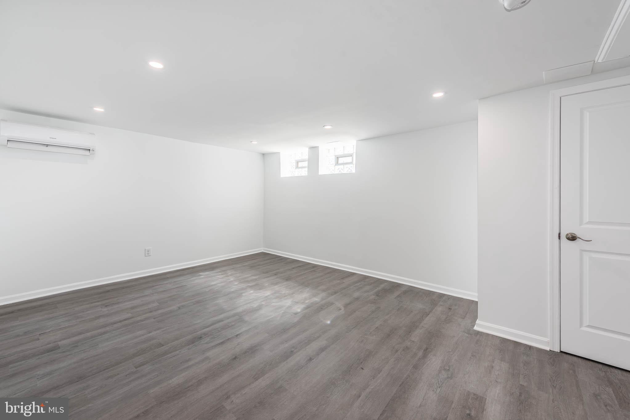 1510 Northbourne Road Baltimore, MD 21239 - Photo 23 of 32 a view of empty room with wooden floor
