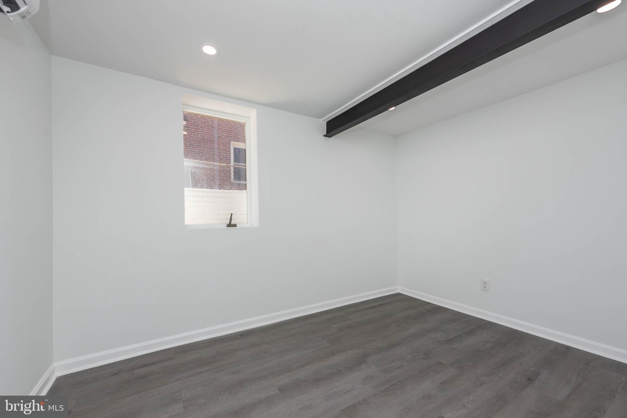 1510 Northbourne Road Baltimore, MD 21239 - Photo 24 of 32 wooden floor in an empty room