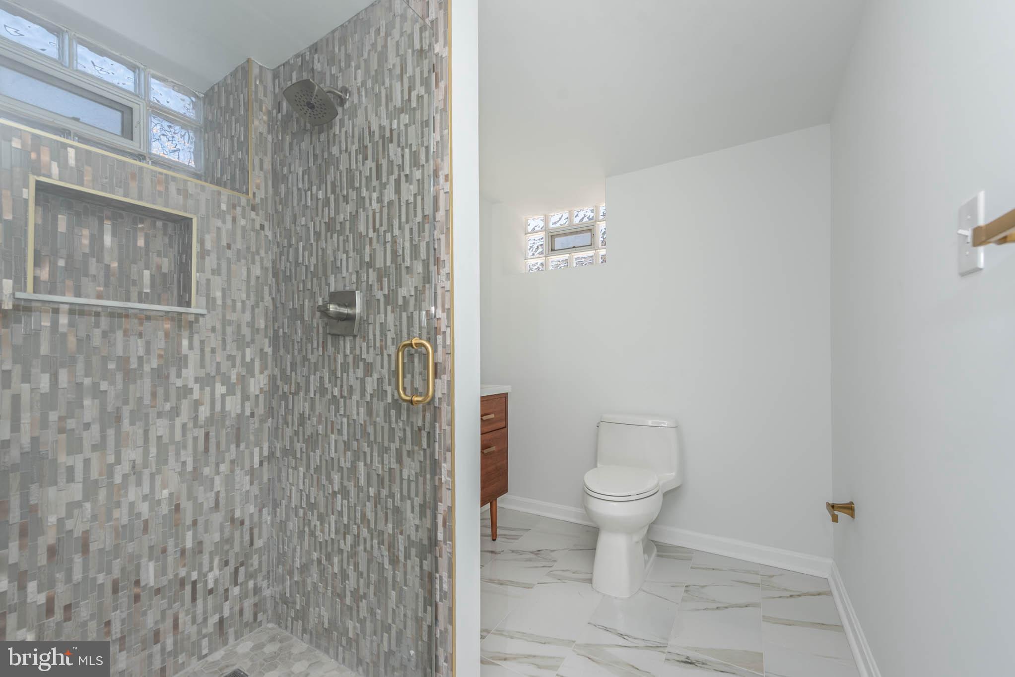 1510 Northbourne Road Baltimore, MD 21239 - Photo 26 of 32 a bathroom with a toilet and a shower