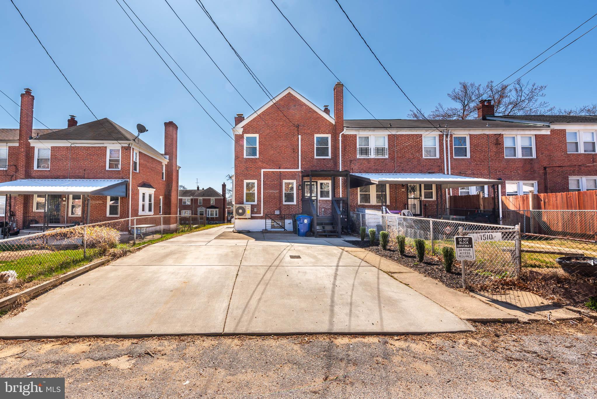 1510 Northbourne Road Baltimore, MD 21239 - Photo 29 of 32 a front view of residential houses with yard