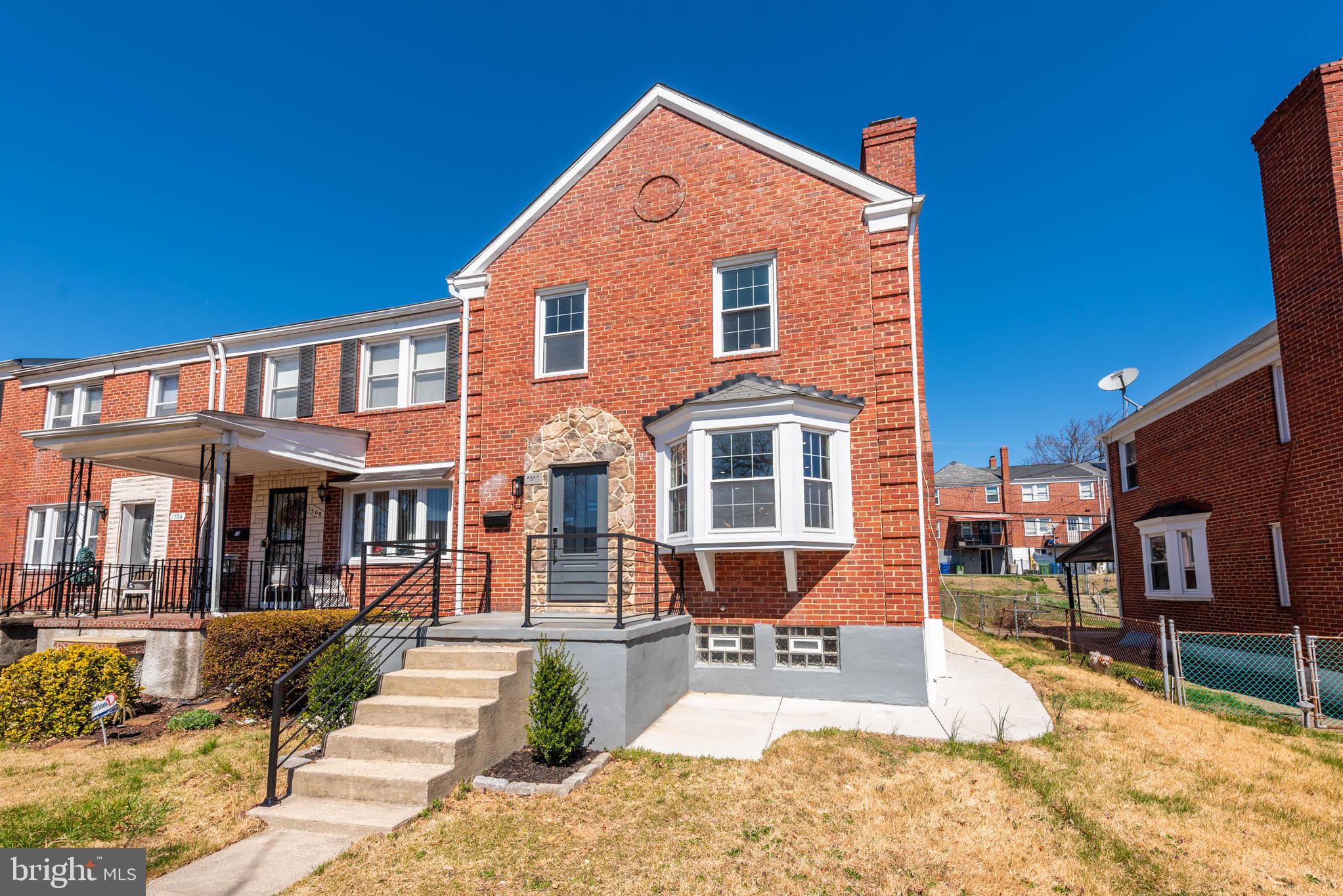 1510 Northbourne Road Baltimore, MD 21239 - Photo 30 of 32 a front view of a house with a yard