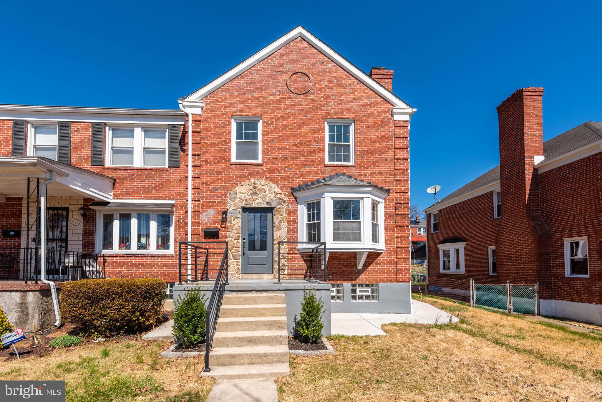 1510 Northbourne Road Baltimore, MD 21239 - Photo 31 of 32 a front view of a house with a yard