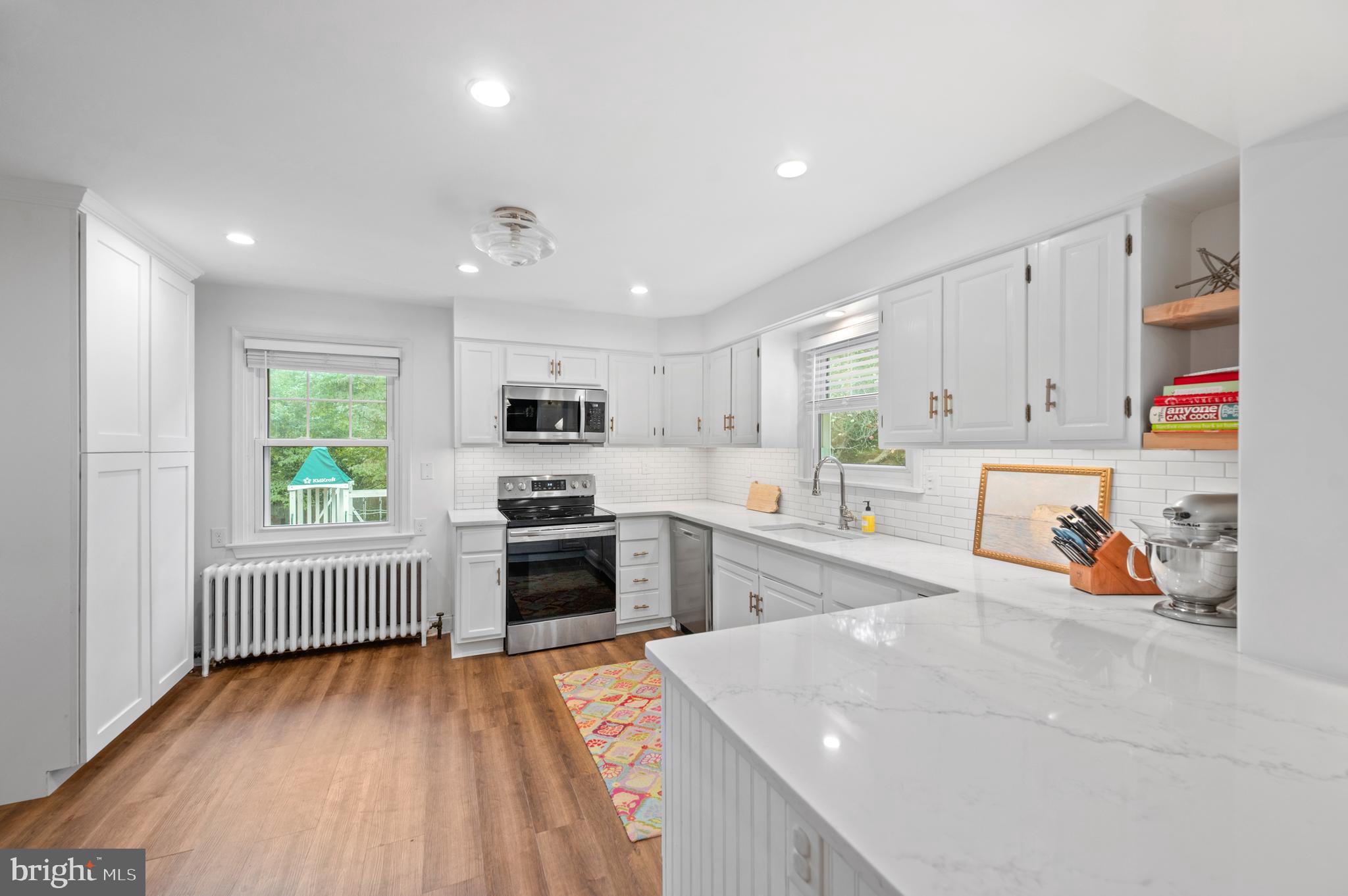 1242 Old Lancaster Road Berwyn, PA 19312 - Photo 12 of 42 a kitchen that has a lot of cabinets a sink and appliances in it
