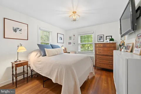 a bed room with a bed and a chandelier