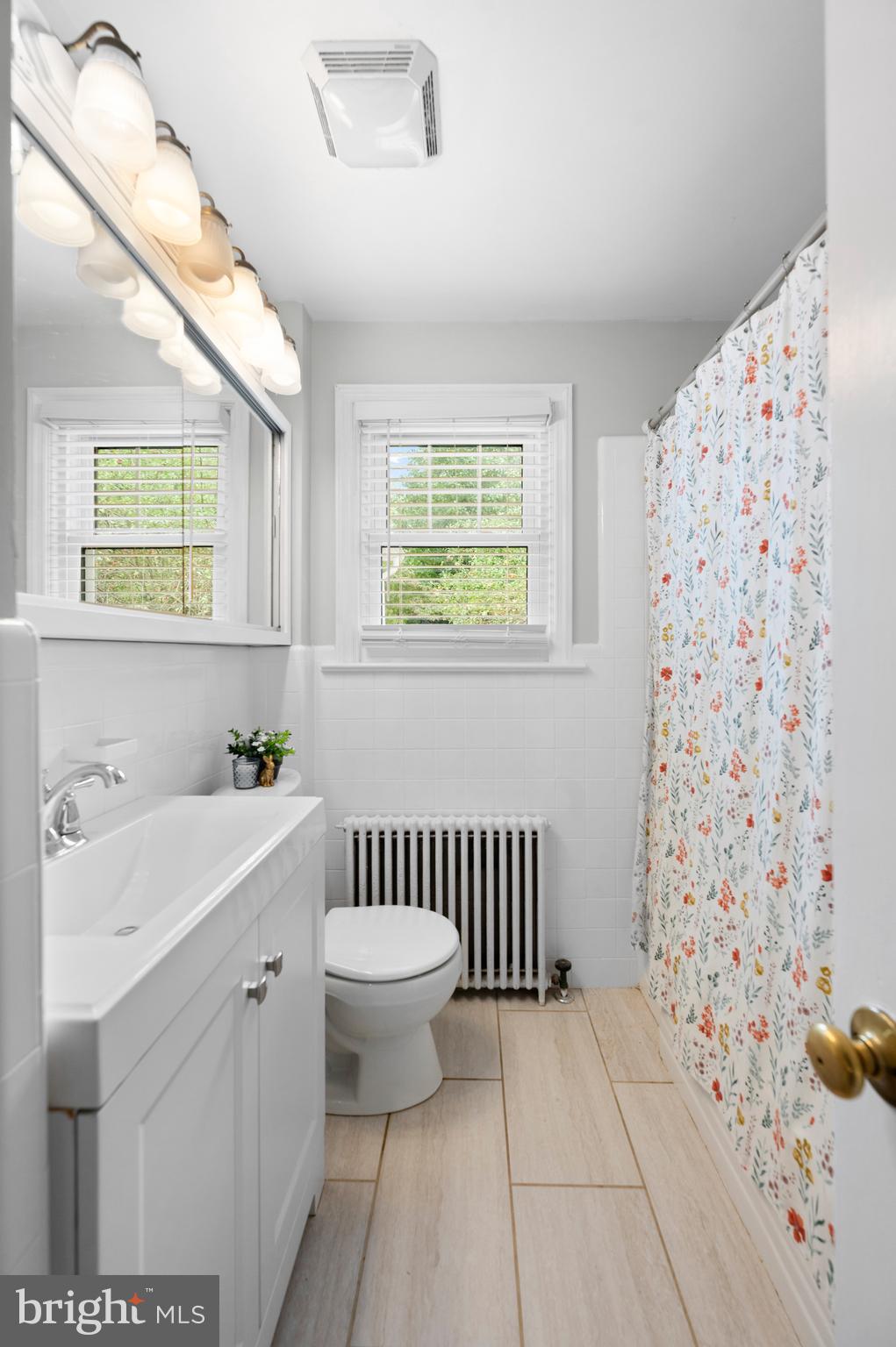 1242 Old Lancaster Road Berwyn, PA 19312 - Photo 18 of 42 a bathroom with a sink toilet and shower