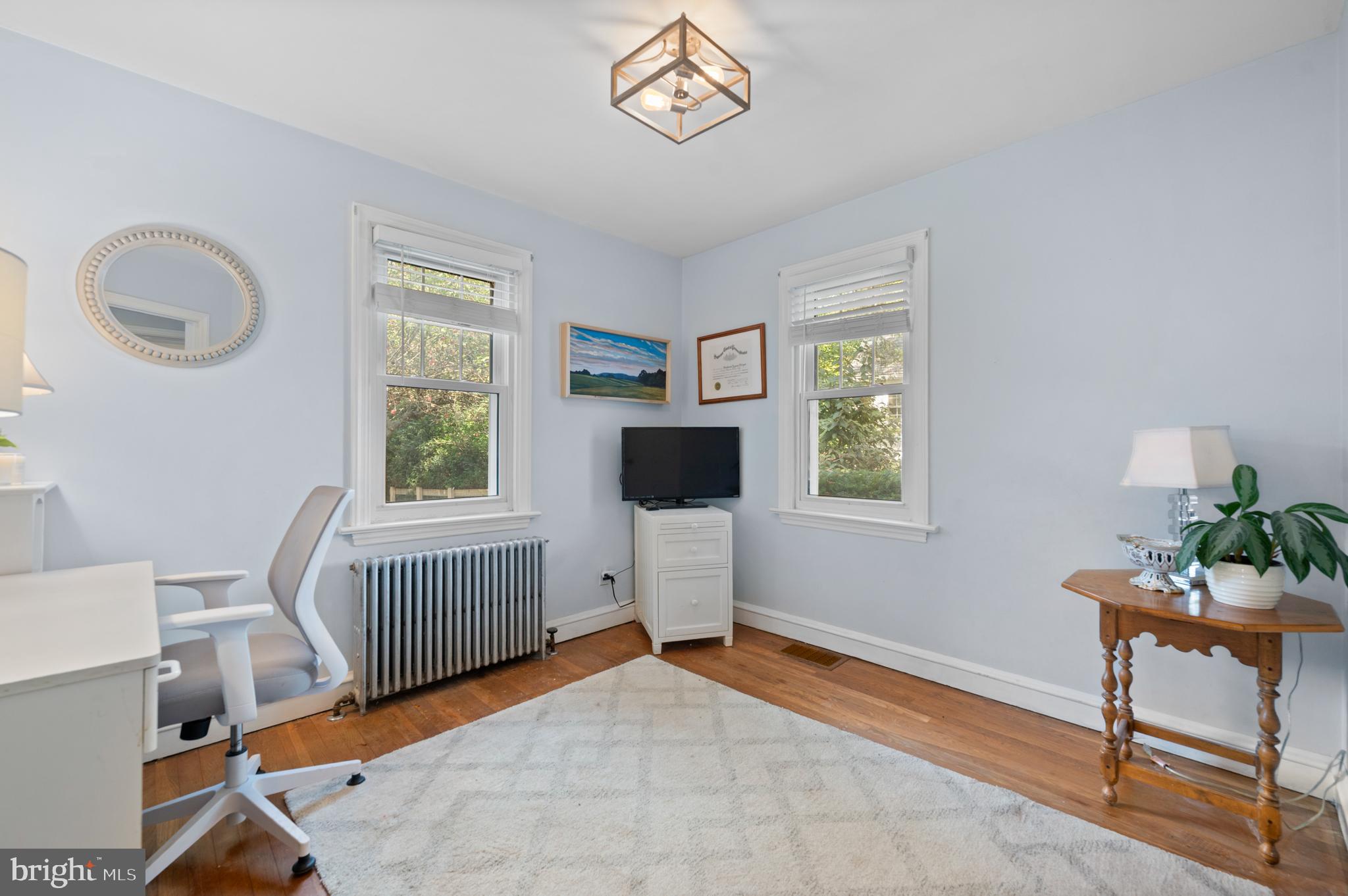 1242 Old Lancaster Road Berwyn, PA 19312 - Photo 19 of 42 a bedroom with a bed and a window