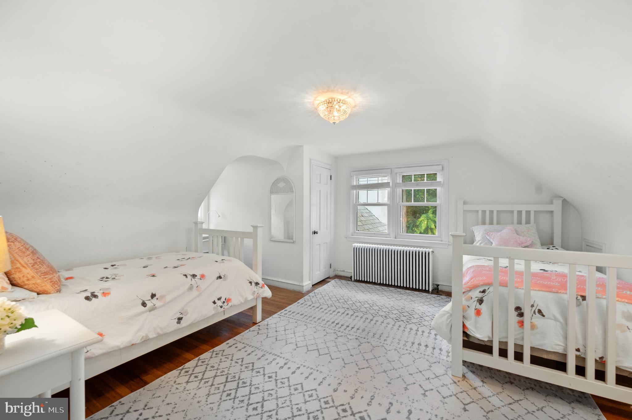 1242 Old Lancaster Road Berwyn, PA 19312 - Photo 21 of 42 a bedroom with a bed and a window