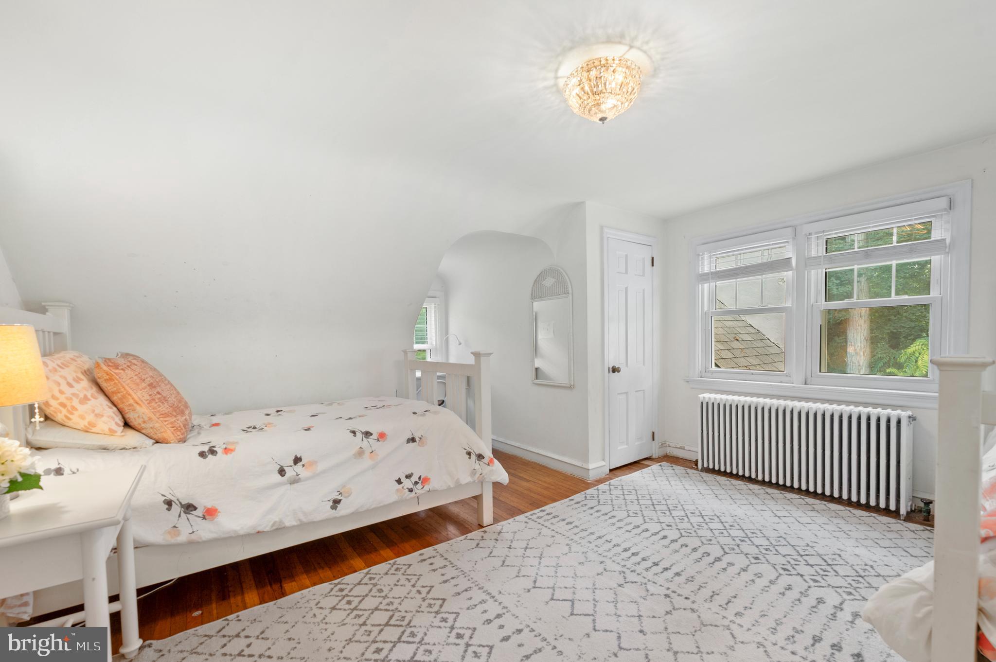 1242 Old Lancaster Road Berwyn, PA 19312 - Photo 22 of 42 a bedroom with a bed and a window