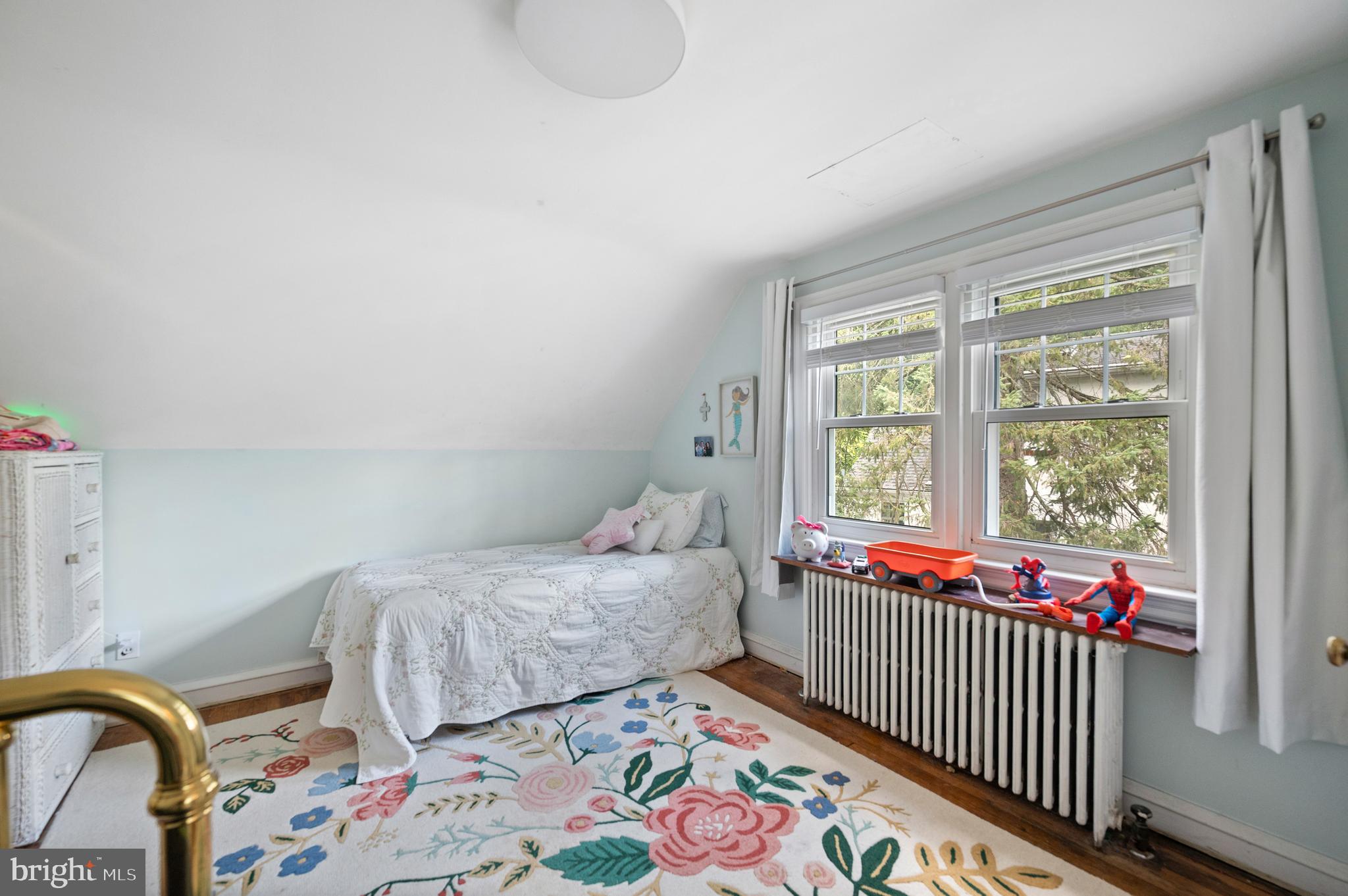 1242 Old Lancaster Road Berwyn, PA 19312 - Photo 24 of 42 a bedroom with a bed and a window