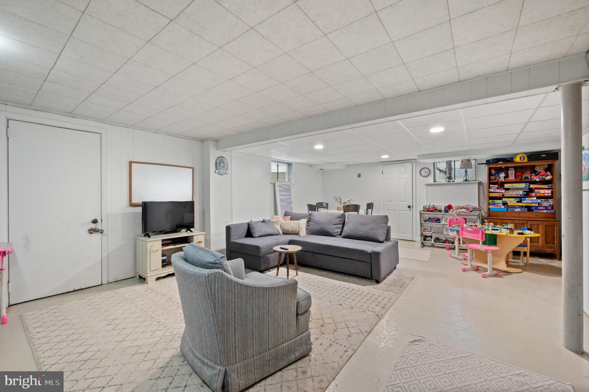 1242 Old Lancaster Road Berwyn, PA 19312 - Photo 26 of 42 a living room with furniture and a flat screen tv