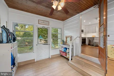 a storage room with wooden floor and furniture