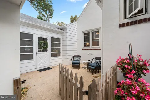 a view of a house with a yard and sitting space