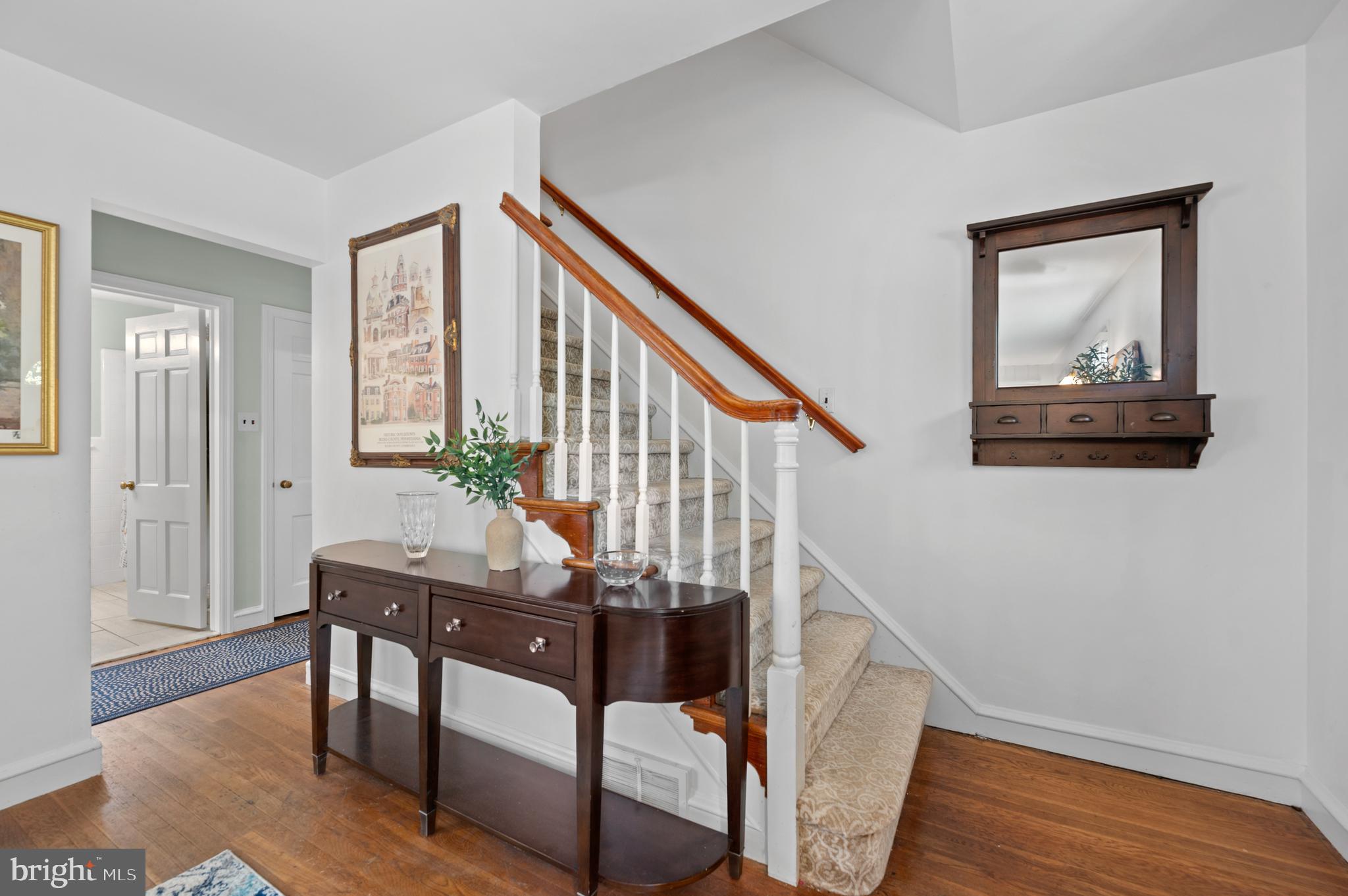 1242 Old Lancaster Road Berwyn, PA 19312 - Photo 6 of 42 a view of an entryway with wooden floor and stairs