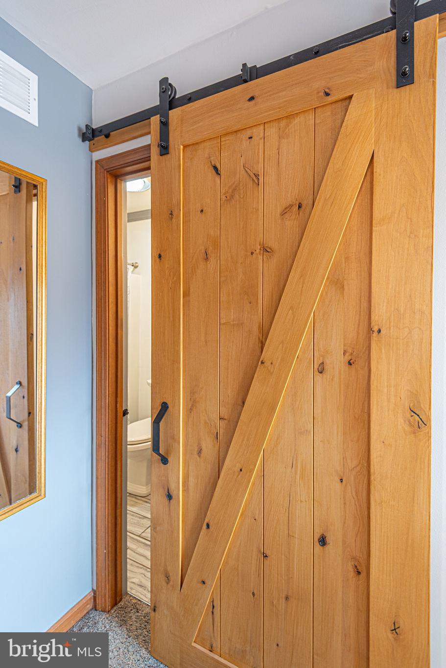 11 Clipper Court Ocean Pines, MD 21811 - Photo 50 of 109 Sliding barn door into main level bathroom