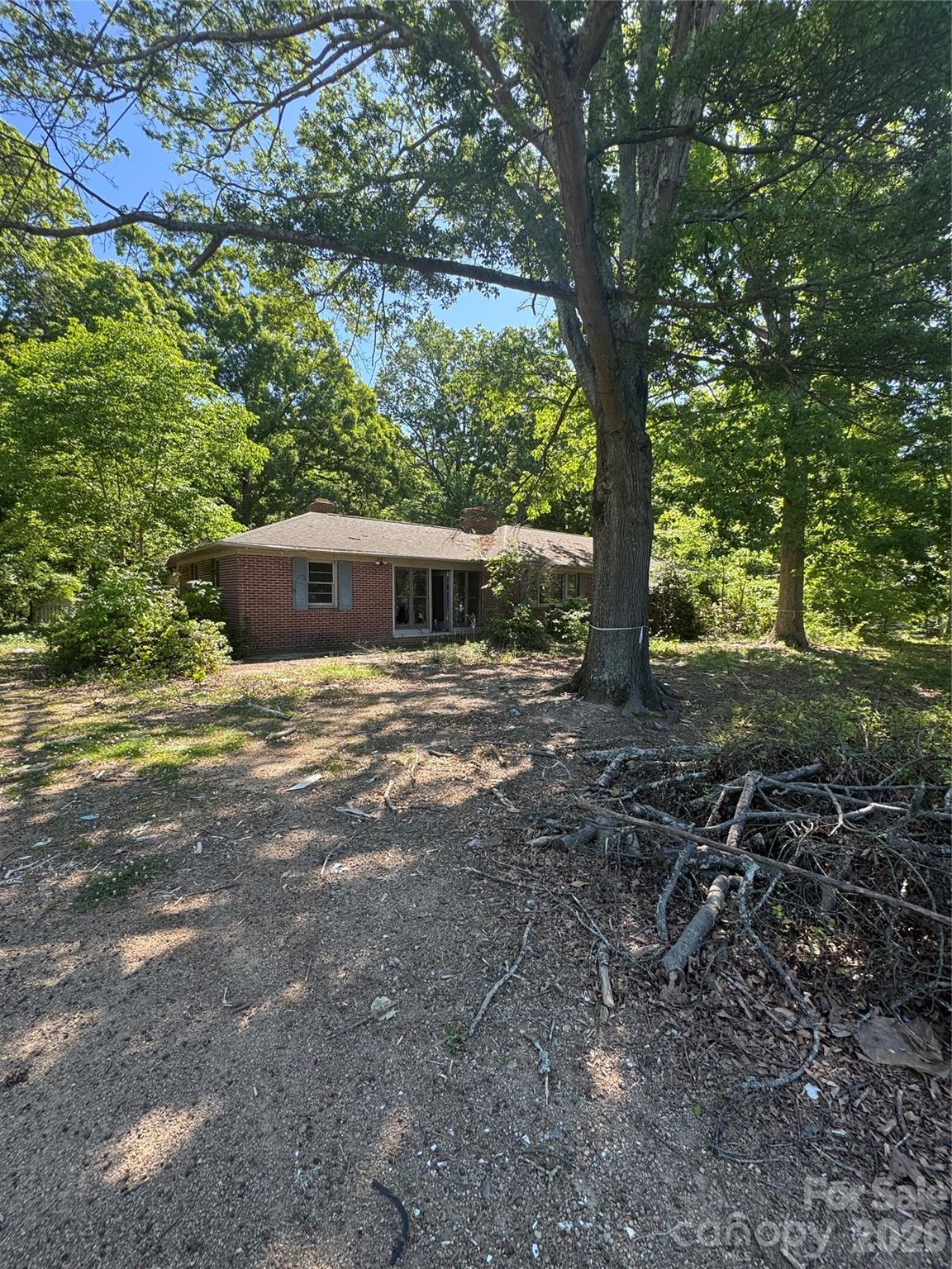 10900 Rozzelles Ferry Road Charlotte, NC 28216 - Photo 2 of 8 a view of a house with a yard