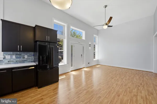 a kitchen with stainless steel appliances a refrigerator and a sink