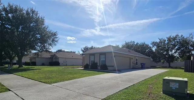 a view of a room with wooden floor and window