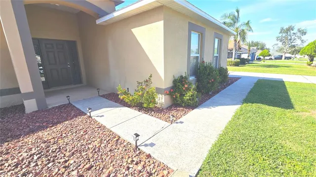 a view of a a dining room with furniture window and wooden floor