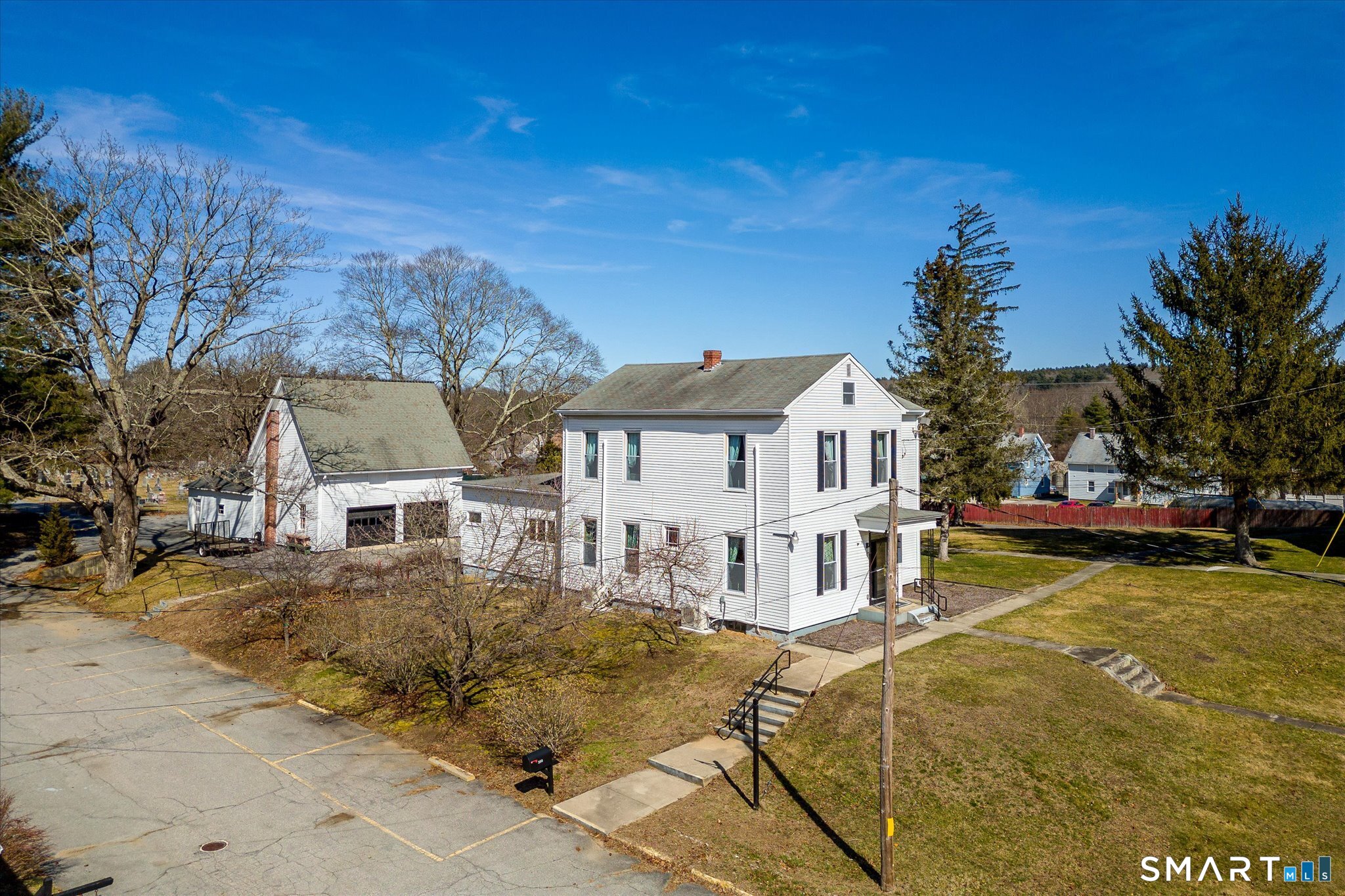 350 Hartford Pike Killingly, CT 06241 - Photo 2 of 28 a view of a white house with a large tree next to a yard