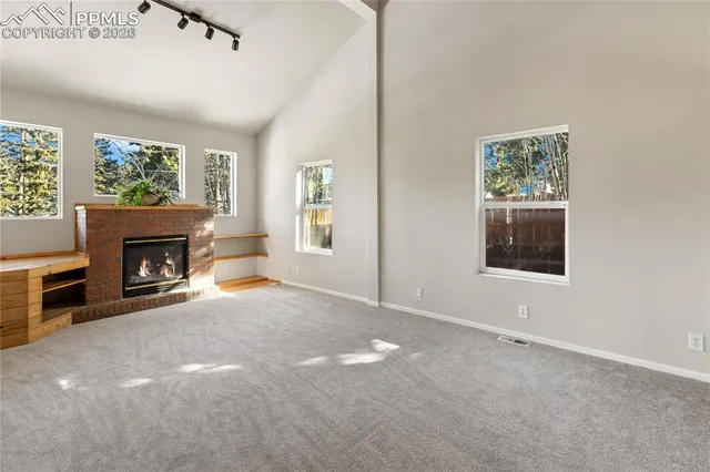 a view of livingroom with furniture and workspace