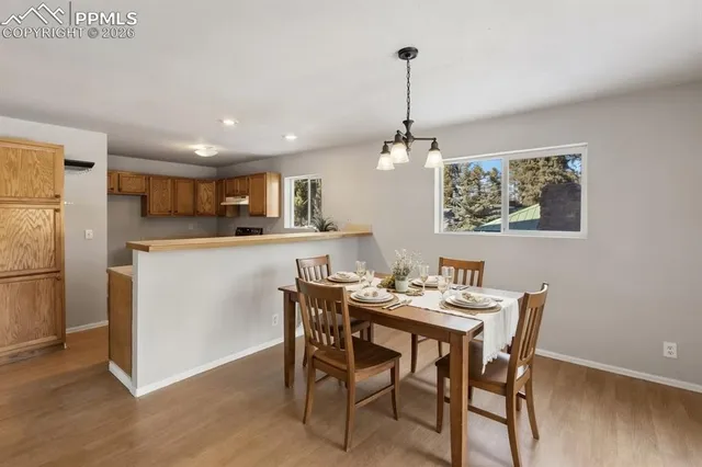 a view of a kitchen with a sink and a refrigerator