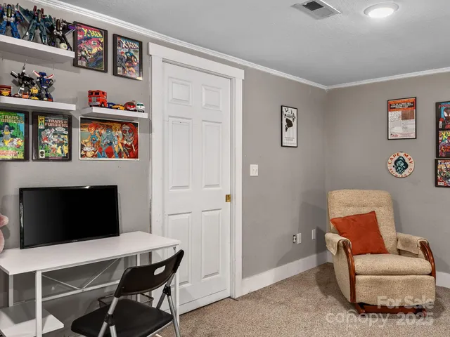 a room with furniture wall paintings and a window