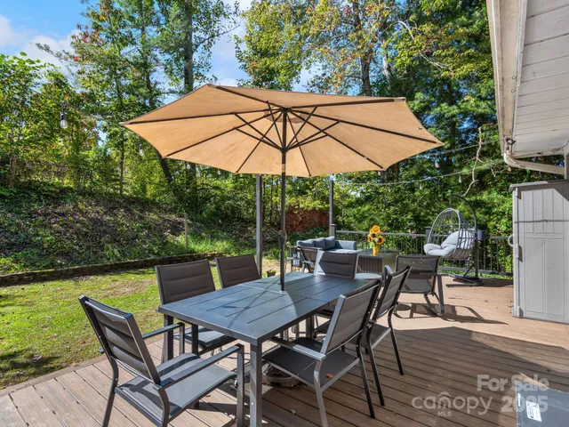a view of backyard with seating space and garden
