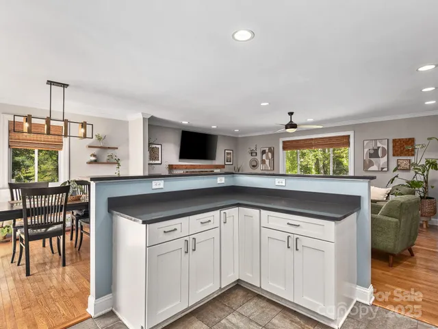 a kitchen with a sink cabinets and window
