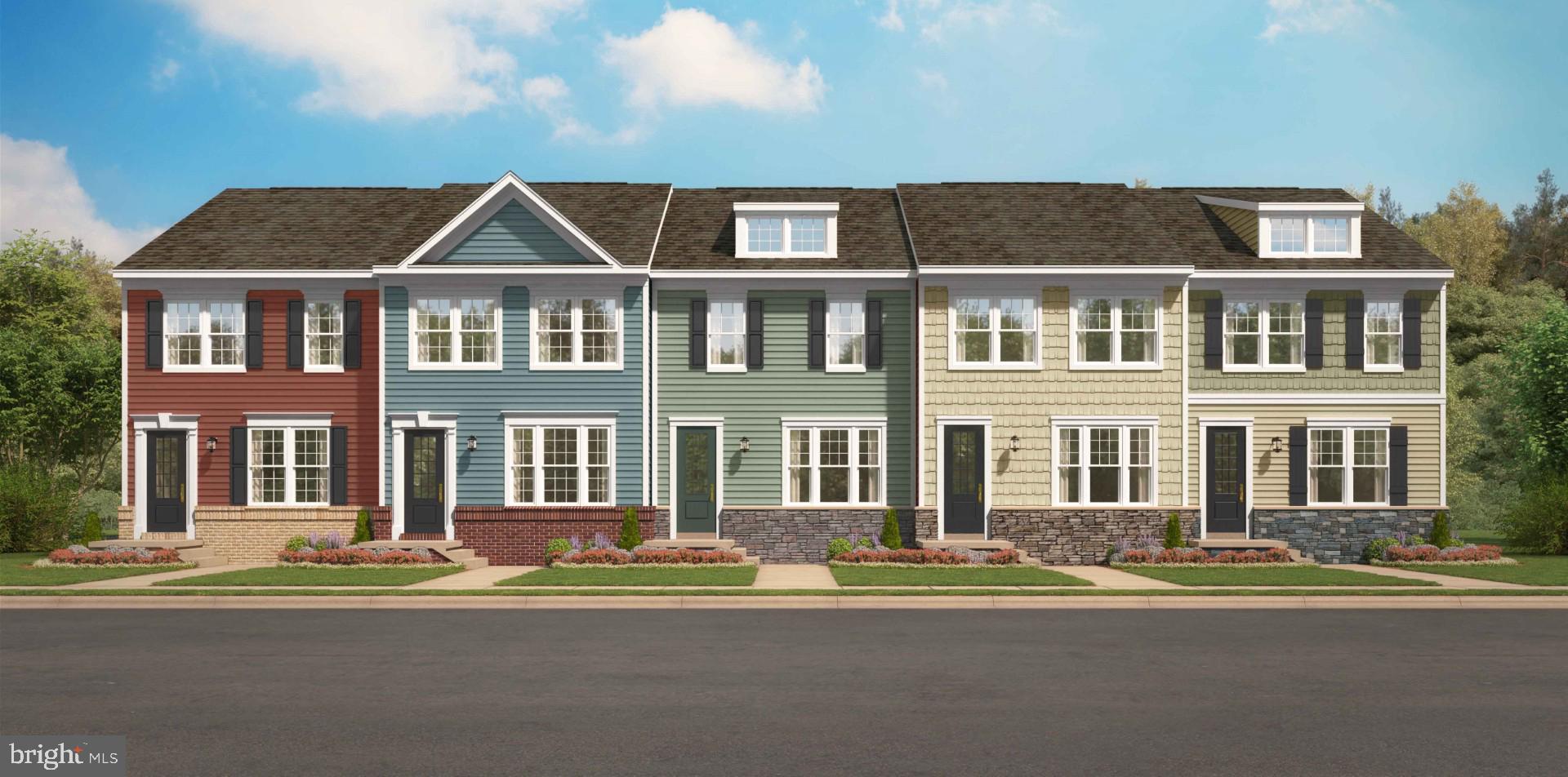 a front view of a residential apartment building with a yard