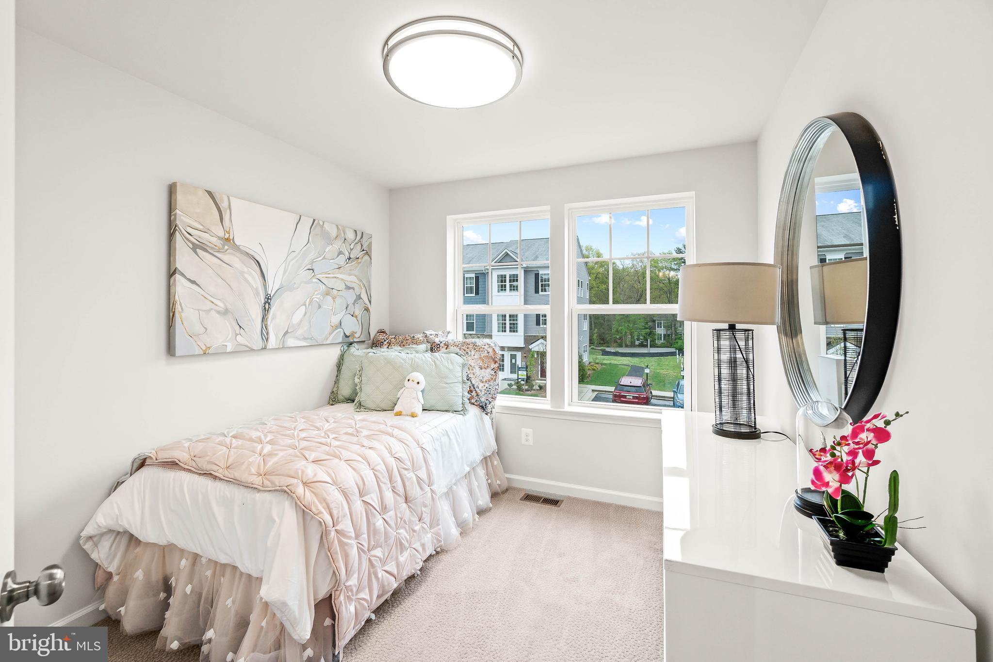 7023 Whispering Run Brandywine, MD 20613 - Photo 10 of 31 a bedroom with a bed and a large window