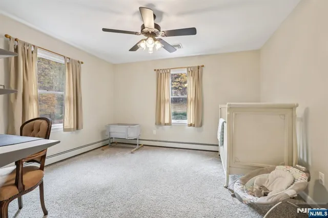 a living room with furniture and windows