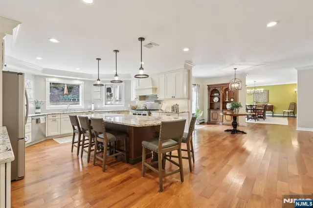 a view of a dining area with furniture and wooden floor