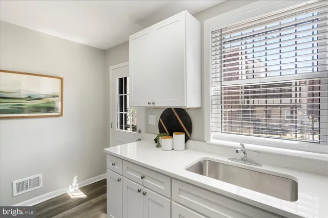 a kitchen with a sink and a window
