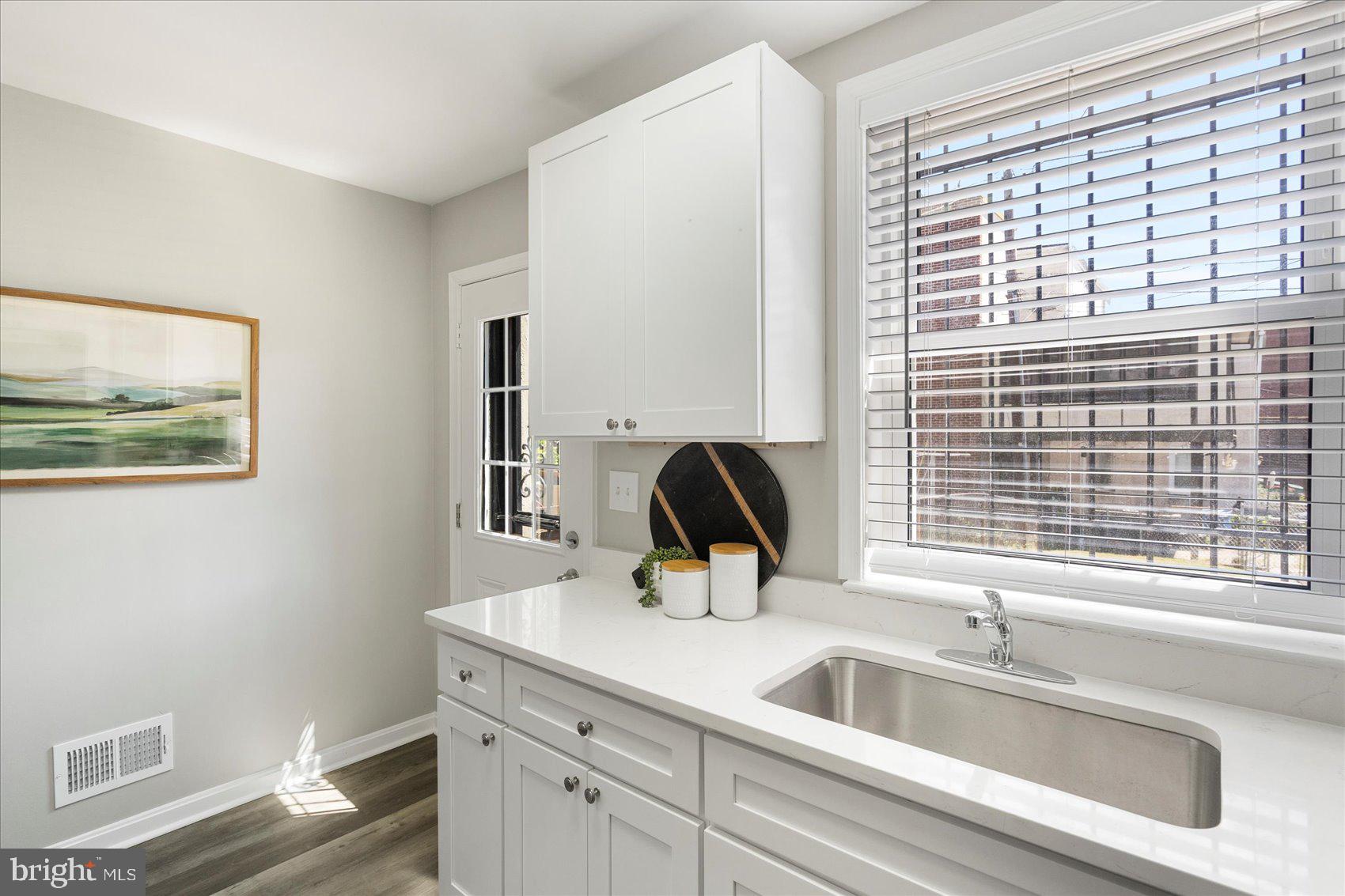 535 Mosher Street Baltimore, MD 21217 - Photo 13 of 28 a kitchen with a sink and a window