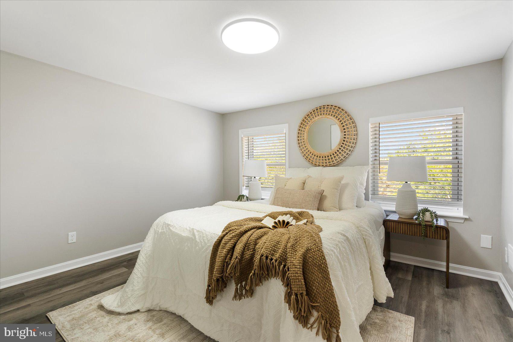 535 Mosher Street Baltimore, MD 21217 - Photo 15 of 28 a bedroom with a bed and a large window