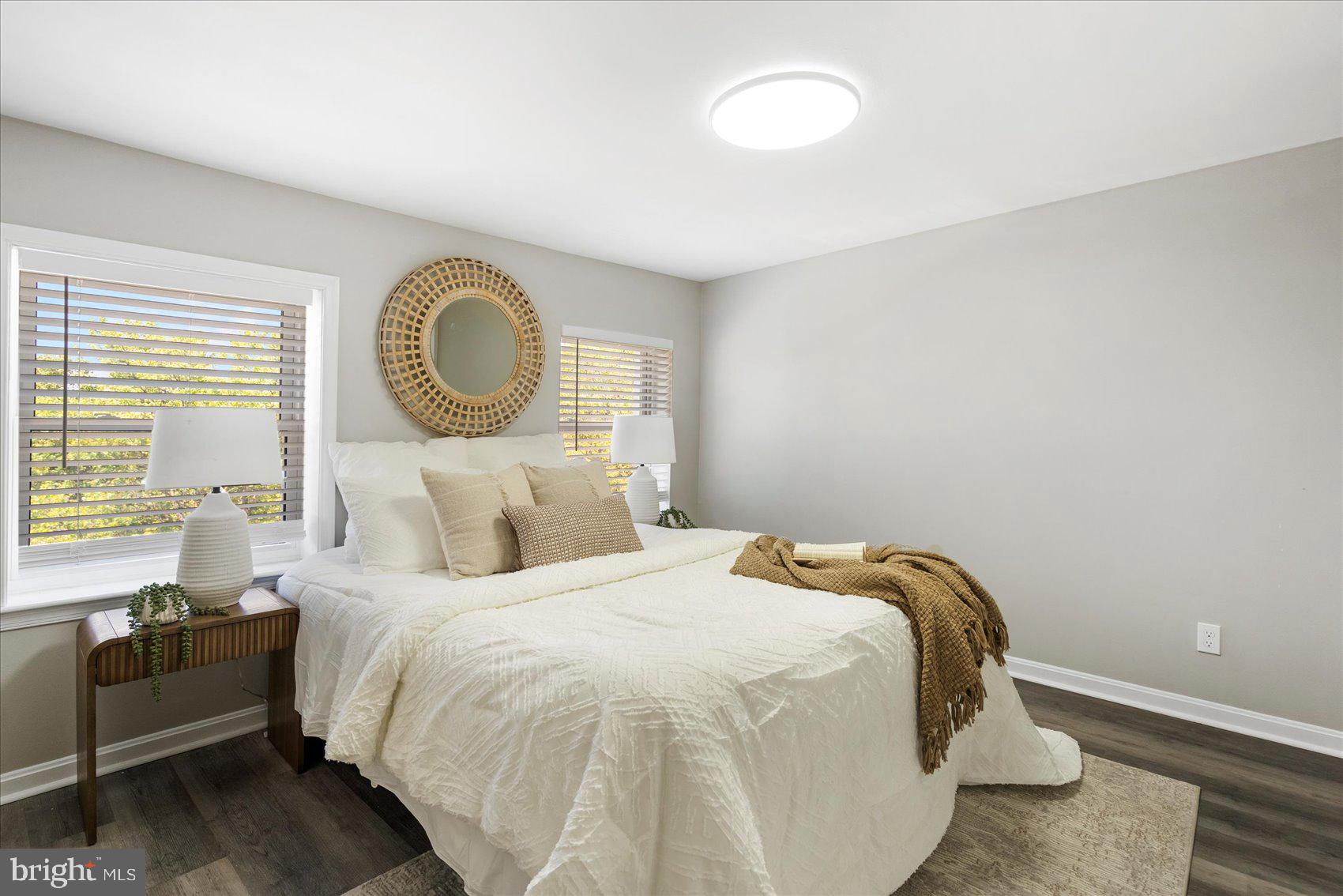 535 Mosher Street Baltimore, MD 21217 - Photo 16 of 28 a bedroom with a bed and a chandelier