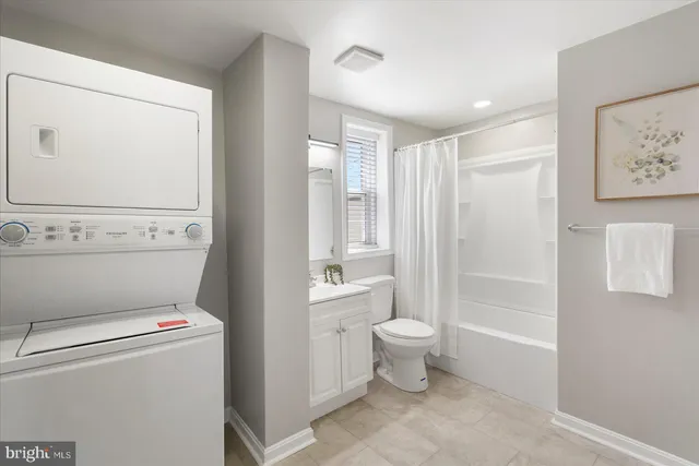 a bathroom with a toilet sink and a shower