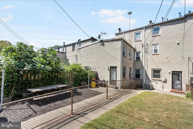 a view of a balcony with yard