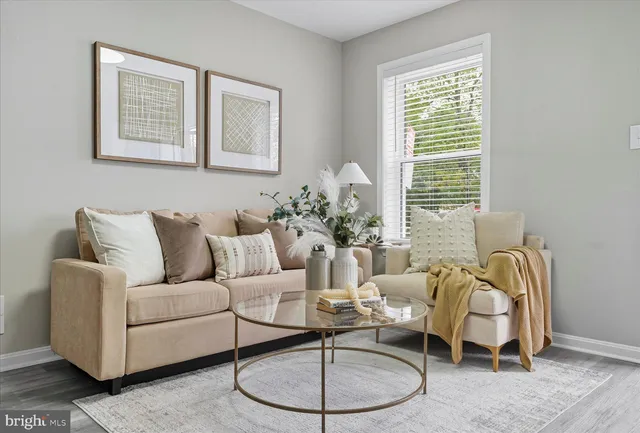 a living room with furniture and a window