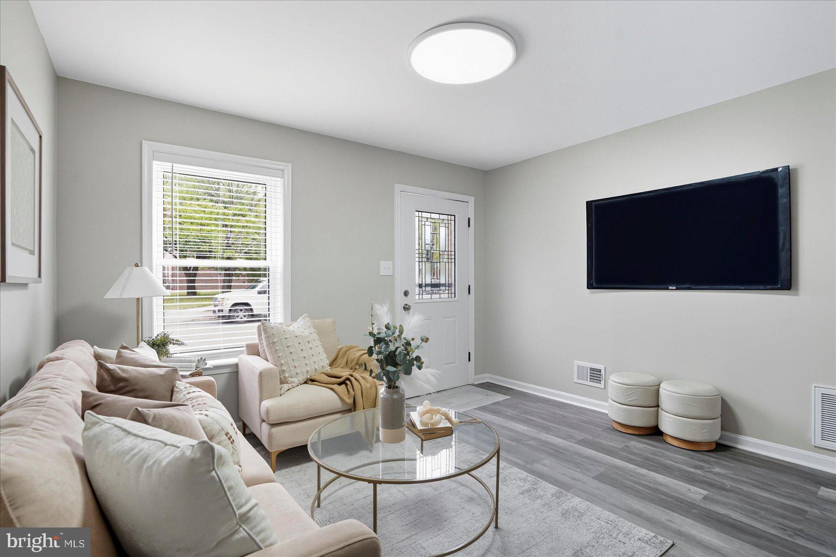 535 Mosher Street Baltimore, MD 21217 - Photo 5 of 28 a living room with furniture and a flat screen tv