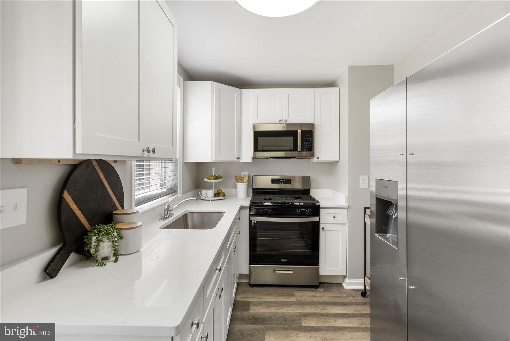 535 Mosher Street Baltimore, MD 21217 - Photo 9 of 28 a kitchen with a sink appliances and cabinets