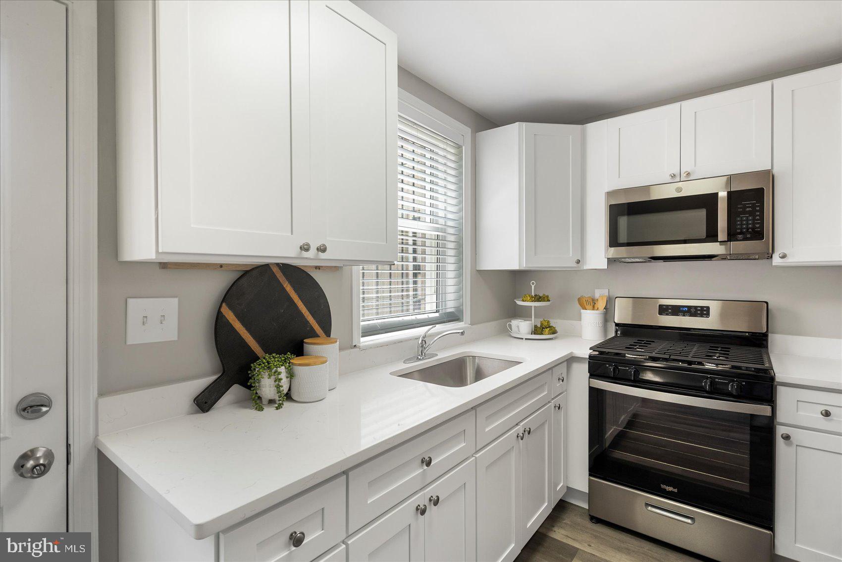 535 Mosher Street Baltimore, MD 21217 - Photo 10 of 28 a kitchen with a sink and appliances