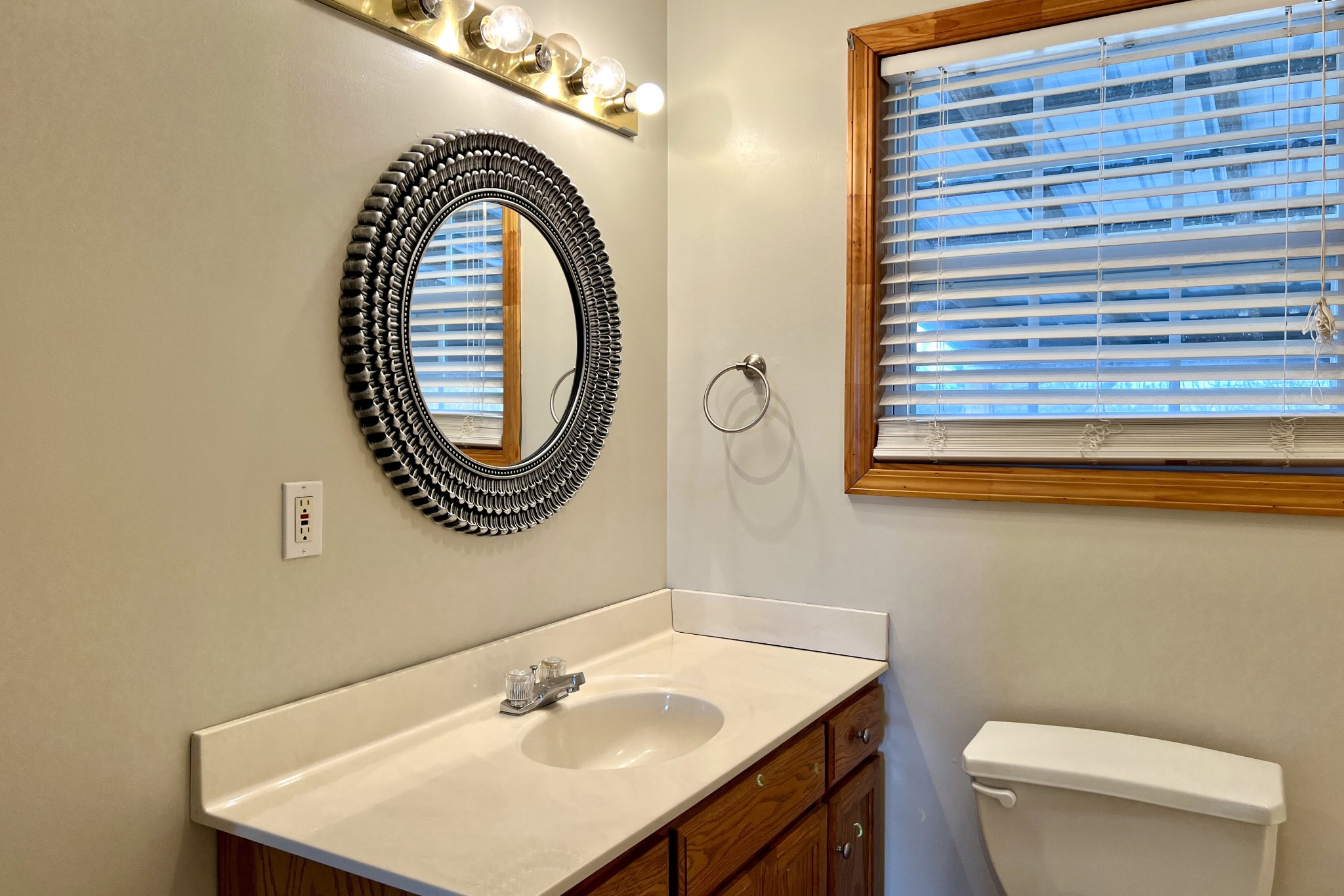 5145 Blackjack Road Franklin, KY 42134 - Photo 13 of 28 a bathroom with a sink a toilet and a mirror