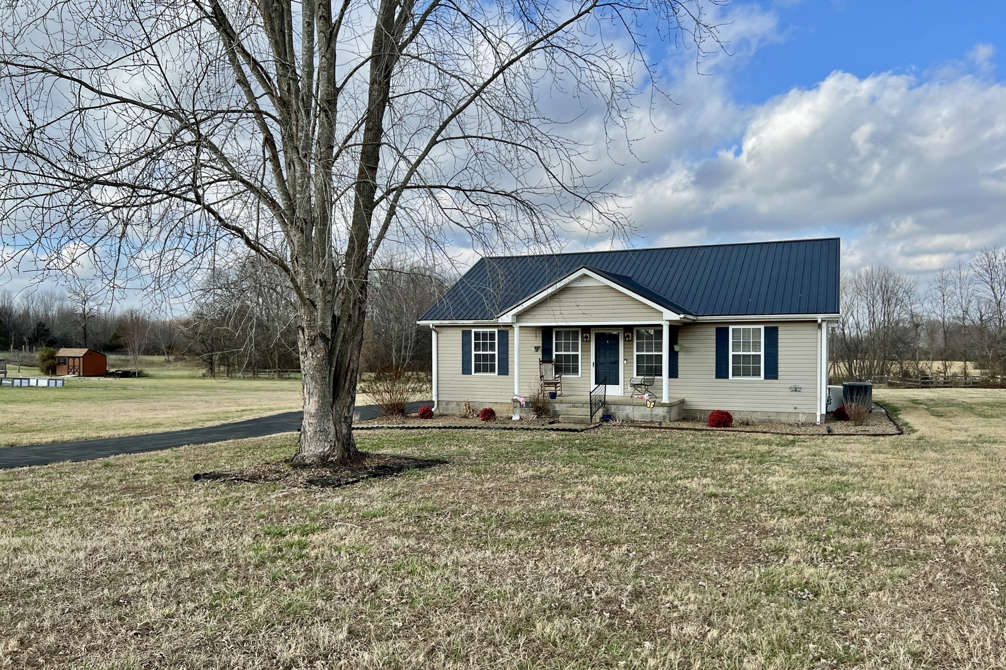 5145 Blackjack Road Franklin, KY 42134 - Photo 23 of 28 a front view of a house with a yard